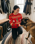 Load image into Gallery viewer, Custom Pet Knitted Holiday Sweater - Santa's Workshop - worn at home with a custom Belgian Malinois portrait named RANGER | Alpha Paw