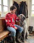 Load image into Gallery viewer, Custom Pet Knitted Holiday Sweater - Fireside Red - worn at home with a custom Irish Wolfhound portrait named FINNEGAN | Alpha Paw