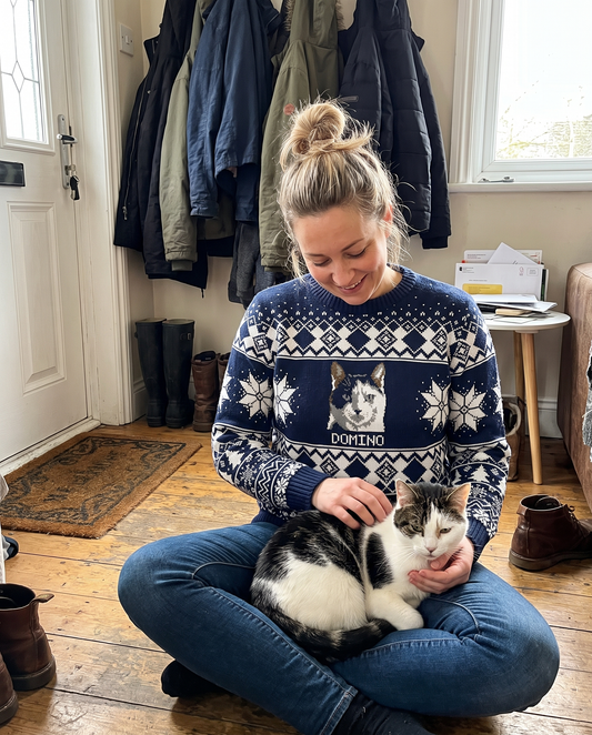 Custom Pet Knitted Holiday Sweater - Winter Sky Blue - worn at home with a custom black-and-white cat portrait named DOMINO | Alpha Paw