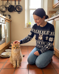 Load image into Gallery viewer, Custom Pet Knitted Holiday Sweater - Winter Sky Blue - worn at home with a custom British Shorthair cat portrait named GOLDIE | Alpha Paw
