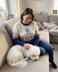 Load image into Gallery viewer, Custom Pet Knitted Holiday Sweater - Arctic Dream Blue - worn at home with a custom Bichon Frise portrait named SNOWBALL | Alpha Paw
