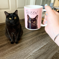 Golden-eyed black cat on a personalized pet coffee mug