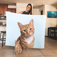 Orange tabby cat on a personalized photo fleece blanket