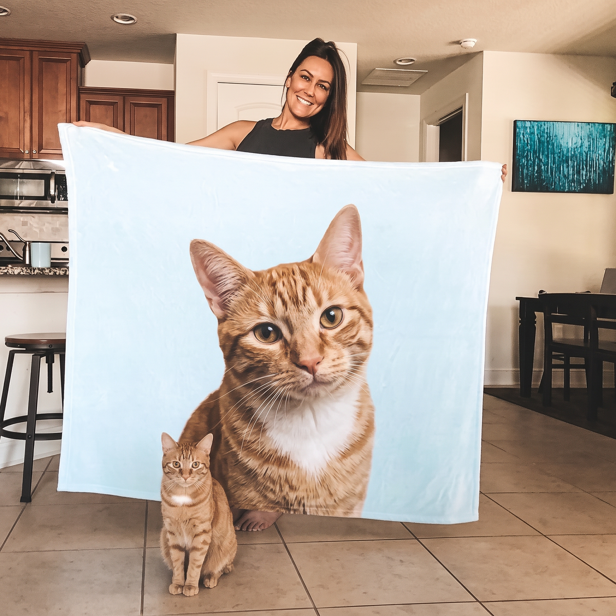 Orange tabby cat on a personalized photo fleece blanket