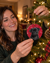 Black pug puppy on a personalized pet Christmas ornament